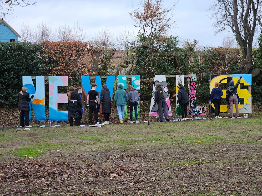 Wide shot of a community mural painted by Tragic O'Hara