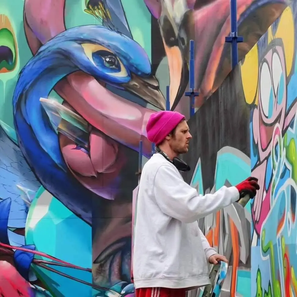 Tragic O'Hara skateboarding or at work on a mural