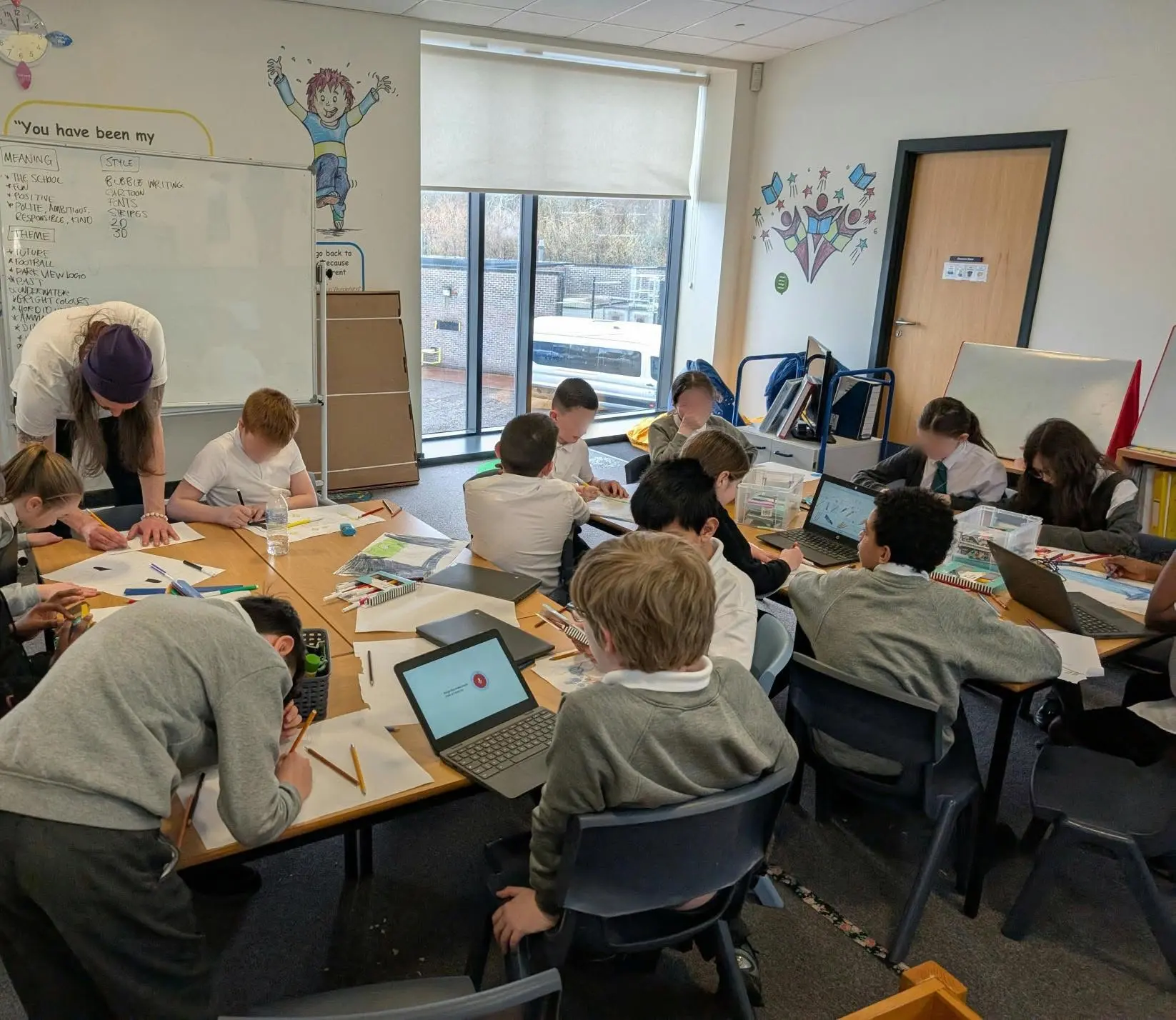 Young people drawing characters in a Tier 1 workshop session
